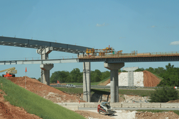 Paving has begun for the bridge deck for the northbound to westbound flyover ramp.